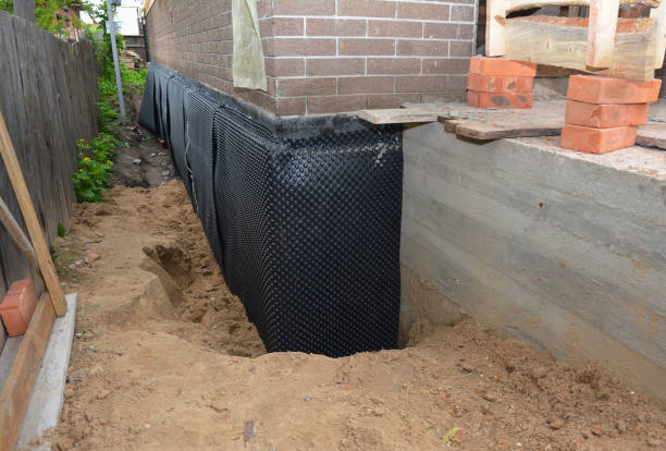 Happy homeowners after waterproofing job in Chauncey